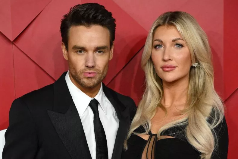 Liam Payne and Kate Cassidy pose on the red carpet upon arrival at The 2022 Fashion Awards in London, England, on December 5, 2022.